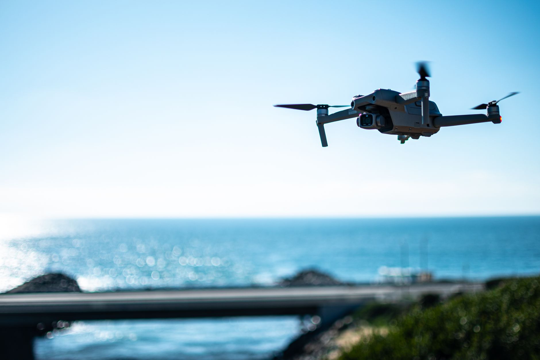 Aerial view of a drone flying over the sea in Carlsbad, California on a sunny day